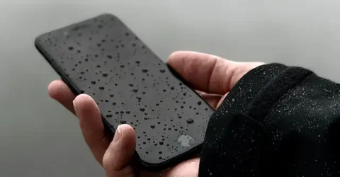 মোবাইল পানিতে পড়লে শুধু মুছলে হবে না! পানি বের করতে যা করবেন